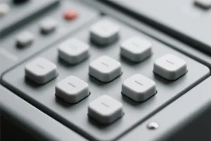 Close up of a minimal designed control interface with grey buttons and grey panelling