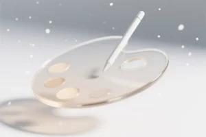 A large smooth translucent glass paint palette glowing with a faint internal light beige hue.