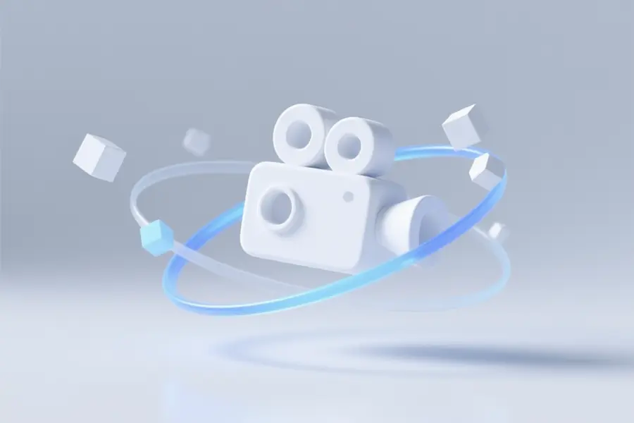 Floating white video camera icon suspended in mid-air stylized as a three-dimensional symbol of creation