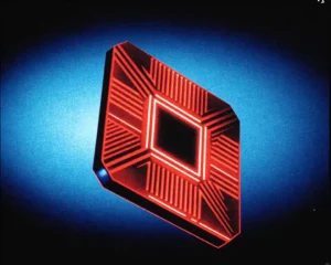 A glowing red AMD Radeon GPU chip made up of a luminous crystalline circuitry.
