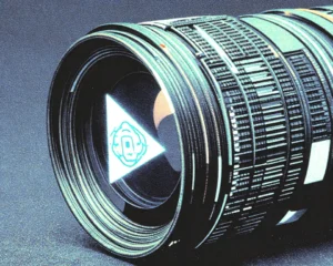 A huge close up of a camera lens with a still image on its surface.