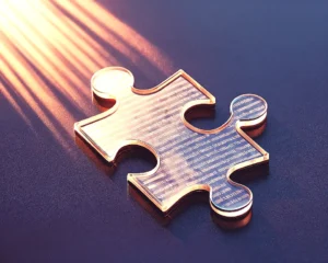 Close up object of a shattered puzzle piece magically reassembling itself.