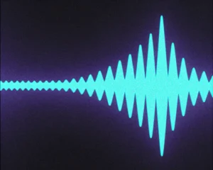 Glowing sound wave constructed from a luminous continuous fluid mesh.