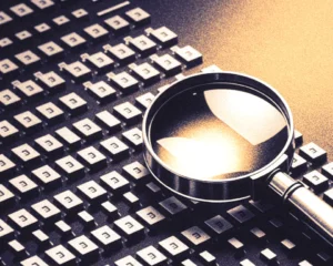 Small sleek magnifying glass hovering over floating digital code blocks.