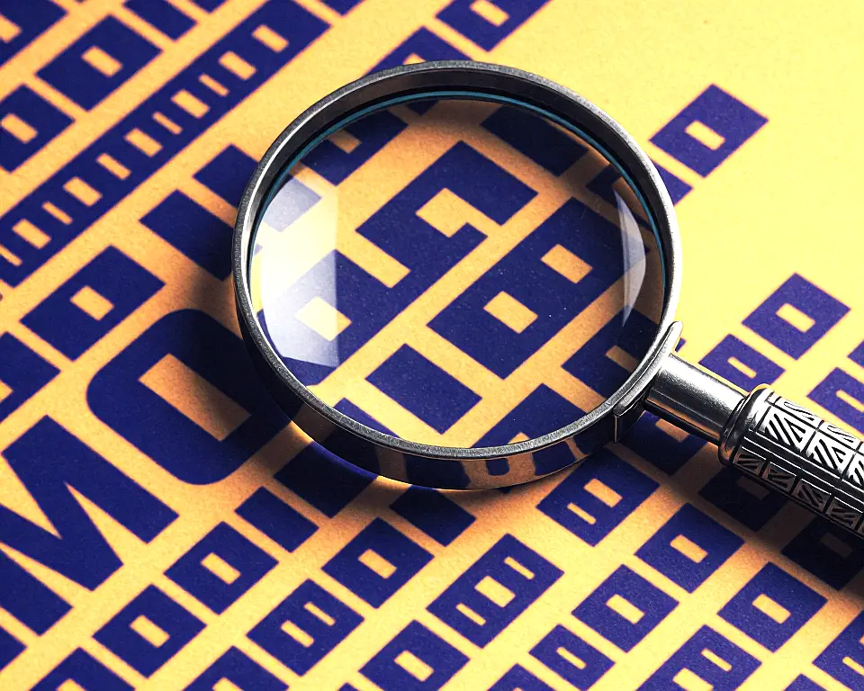 A large magnifying glass searching over garbled text.